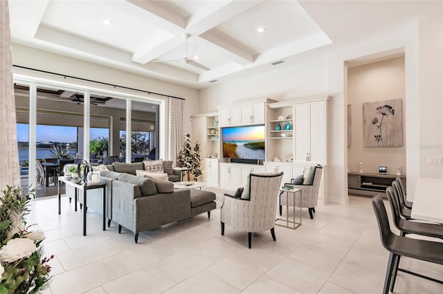 tiled living room featuring ceiling fan, beam ceiling, a towering ceiling, and coffered ceiling