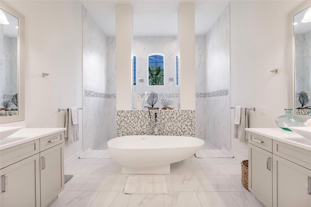 bathroom with vanity, a shower, and tile walls