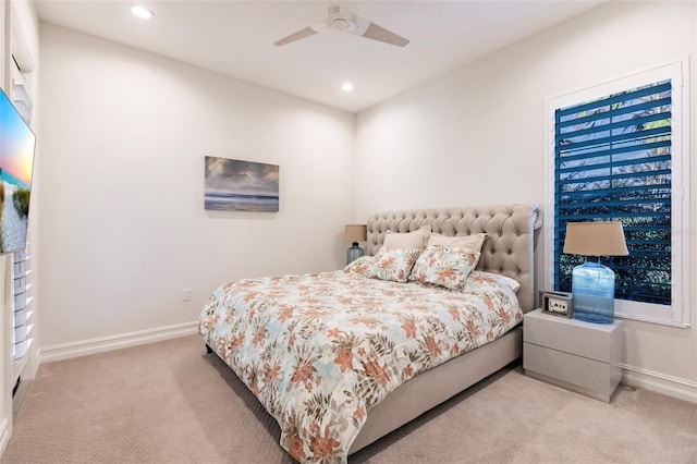 bedroom featuring ceiling fan and light colored carpet