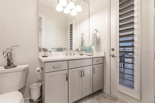 bathroom featuring vanity and toilet