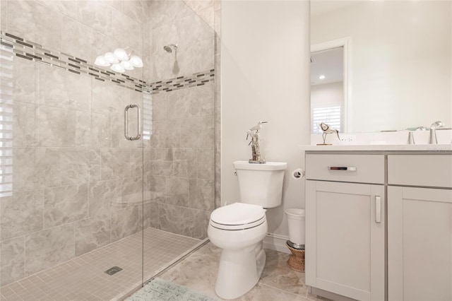 bathroom featuring tile patterned flooring, a shower with door, vanity, and toilet