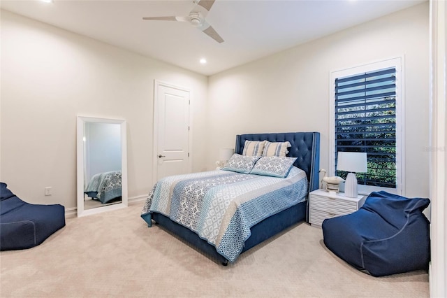 bedroom with ceiling fan and carpet