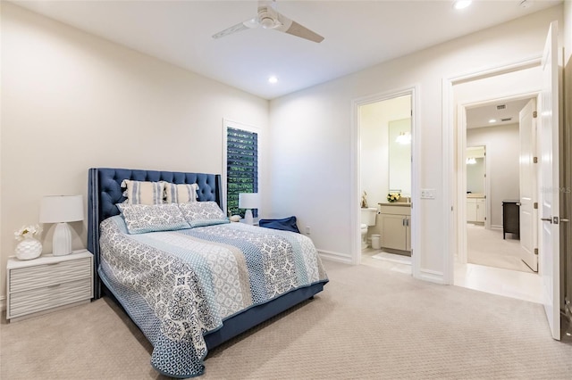 carpeted bedroom featuring connected bathroom and ceiling fan