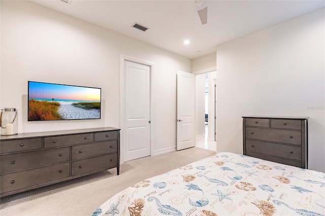 bedroom with ceiling fan and light colored carpet