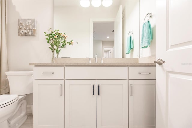 bathroom with vanity and toilet