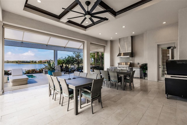 dining space featuring coffered ceiling, ceiling fan, a water view, beamed ceiling, and a high ceiling