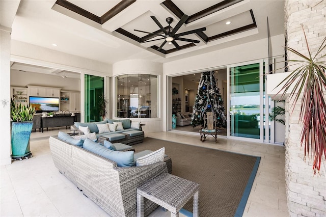 interior space featuring beamed ceiling, ceiling fan, and coffered ceiling