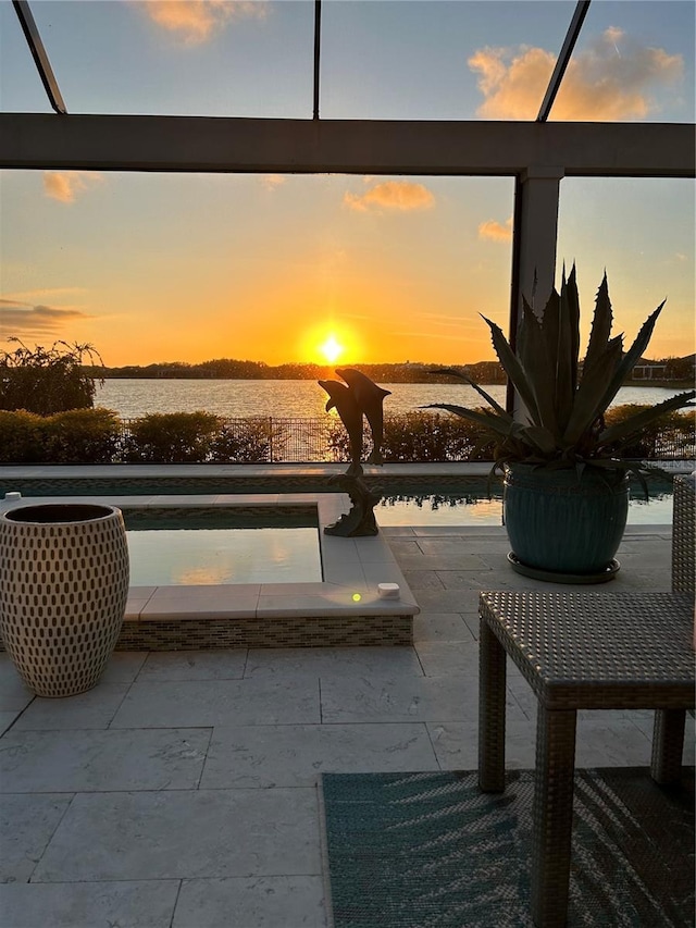 patio terrace at dusk with a water view