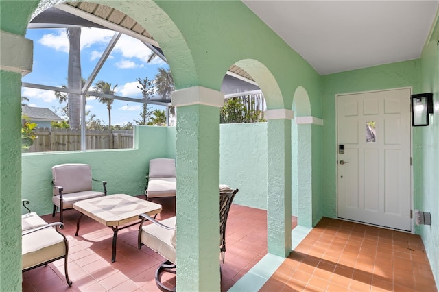 view of patio / terrace with a lanai