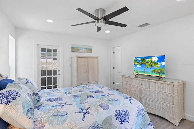 bedroom featuring light hardwood / wood-style floors and ceiling fan