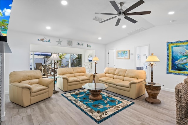 living room featuring light hardwood / wood-style floors, ceiling fan, and lofted ceiling