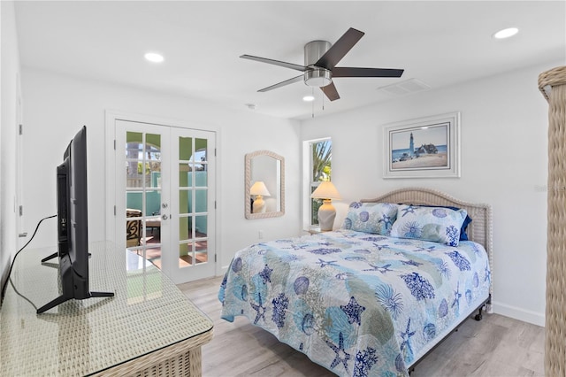 bedroom with french doors, light hardwood / wood-style flooring, and ceiling fan