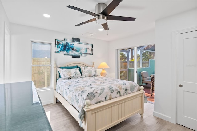 bedroom with hardwood / wood-style floors and ceiling fan