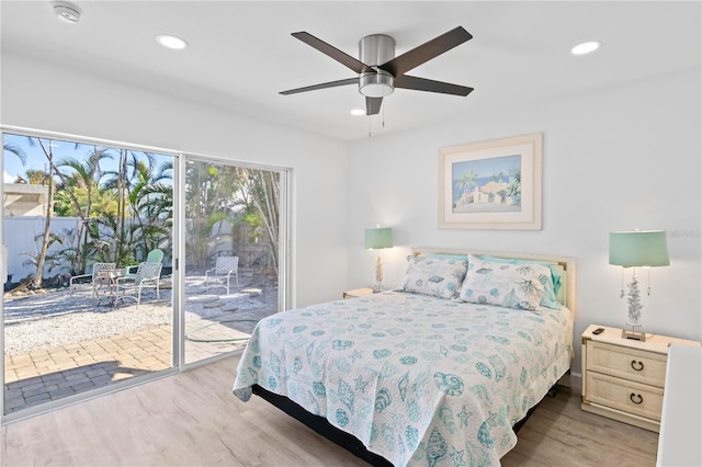 bedroom with access to exterior, light hardwood / wood-style floors, and ceiling fan