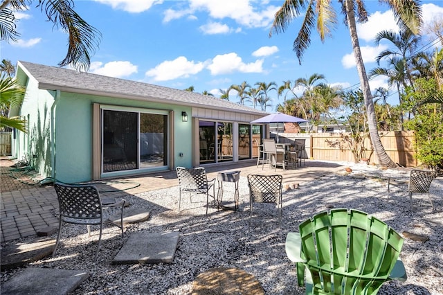 rear view of property featuring a patio