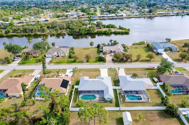 birds eye view of property with a water view