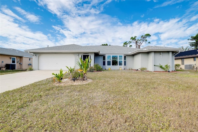 ranch-style house featuring a front yard and a garage