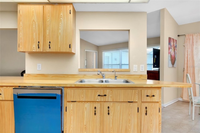 kitchen with dishwashing machine, light brown cabinetry, kitchen peninsula, and sink