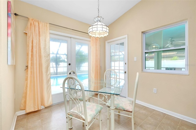 dining area featuring ceiling fan, plenty of natural light, and french doors