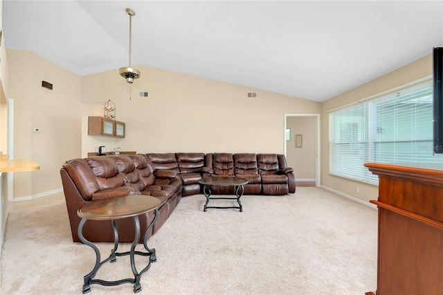 carpeted living room with lofted ceiling