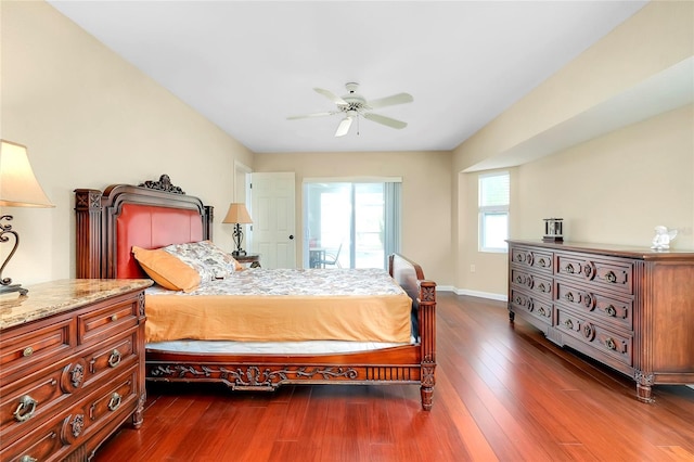 bedroom with ceiling fan and dark wood-type flooring