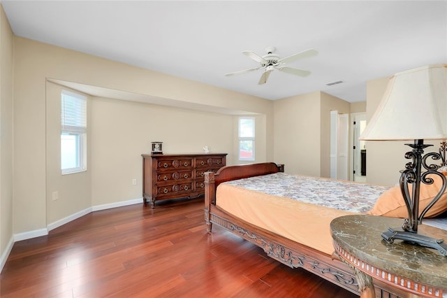 bedroom featuring ceiling fan and dark wood-type flooring