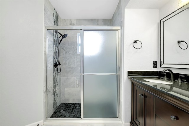 bathroom with vanity and walk in shower