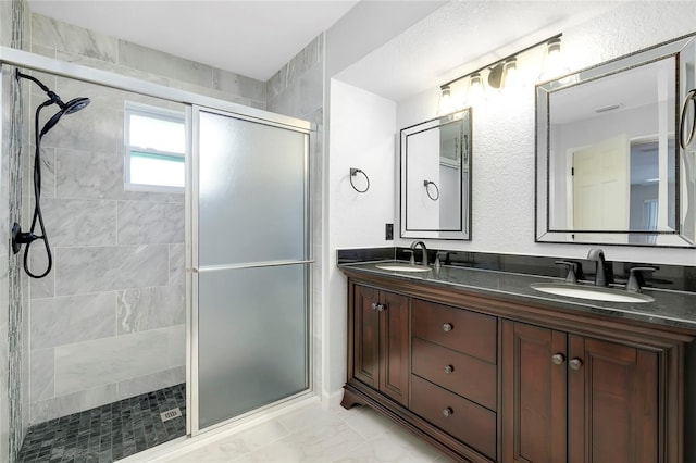 bathroom with vanity and walk in shower