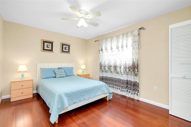 bedroom featuring ceiling fan and dark hardwood / wood-style floors