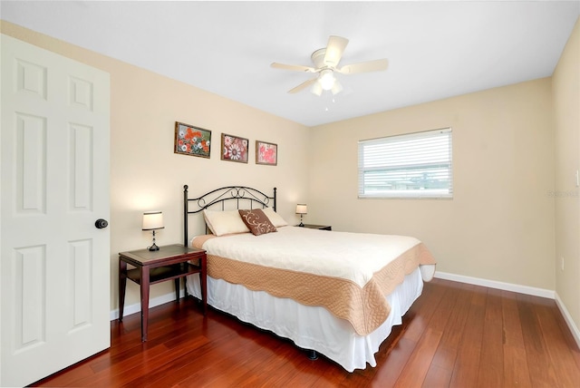 bedroom with ceiling fan and dark hardwood / wood-style flooring