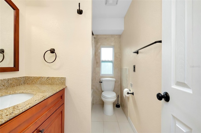 bathroom featuring tile patterned floors, vanity, and toilet