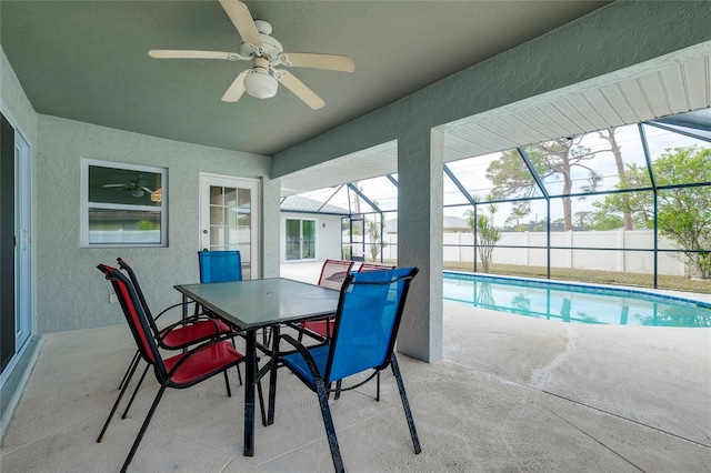 exterior space featuring a lanai, ceiling fan, and a patio