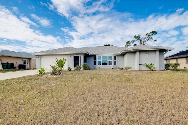 ranch-style home with a garage and a front yard