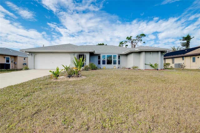 ranch-style house featuring a garage and a front lawn