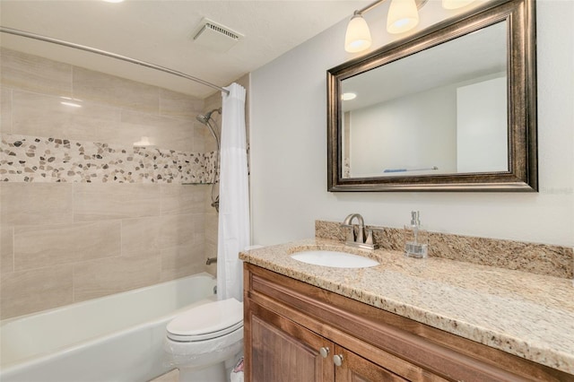 full bathroom with vanity, toilet, and shower / bath combo with shower curtain