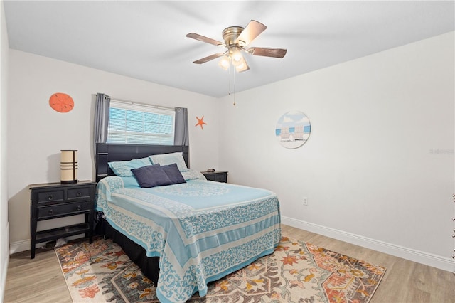 bedroom featuring light hardwood / wood-style floors and ceiling fan