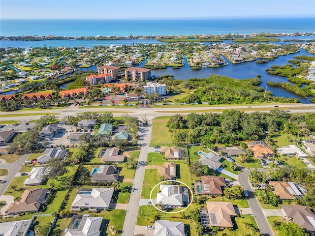 birds eye view of property featuring a water view