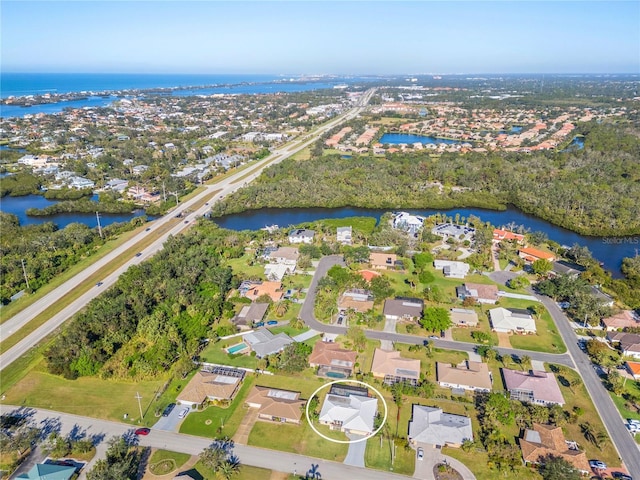 birds eye view of property featuring a water view