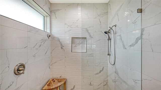 bathroom featuring tiled shower