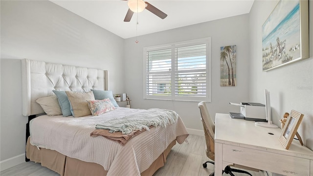 bedroom with ceiling fan and light wood-type flooring