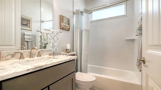 full bathroom with shower / tub combo, vanity, and toilet