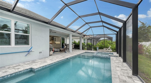 view of swimming pool featuring a lanai, ceiling fan, and a patio