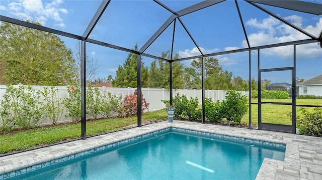 view of swimming pool featuring a lanai