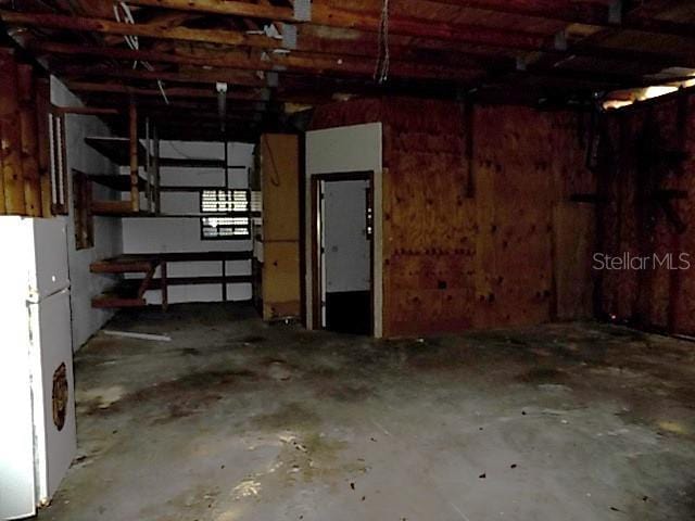 garage featuring white fridge