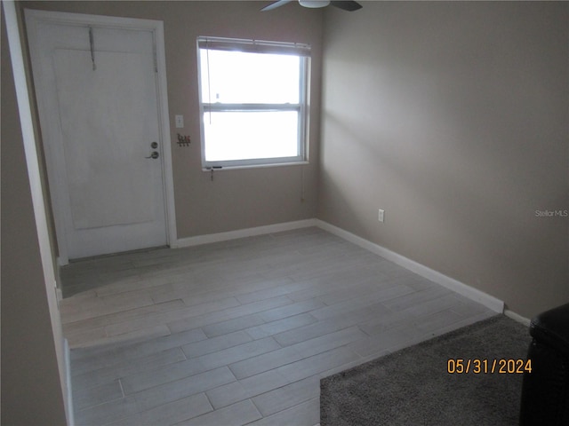 interior space with light hardwood / wood-style floors and ceiling fan