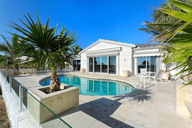 view of pool featuring a patio