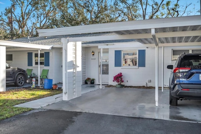 view of front of home featuring a carport