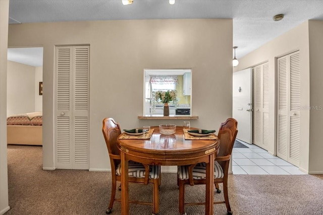 view of carpeted dining area