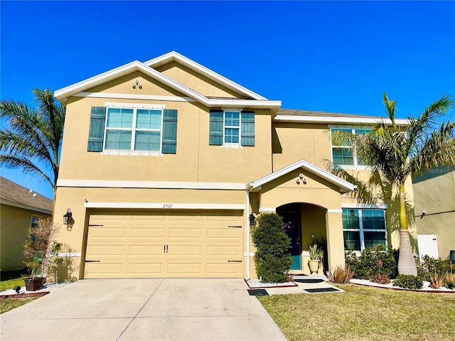 view of front of home featuring a front yard and a garage