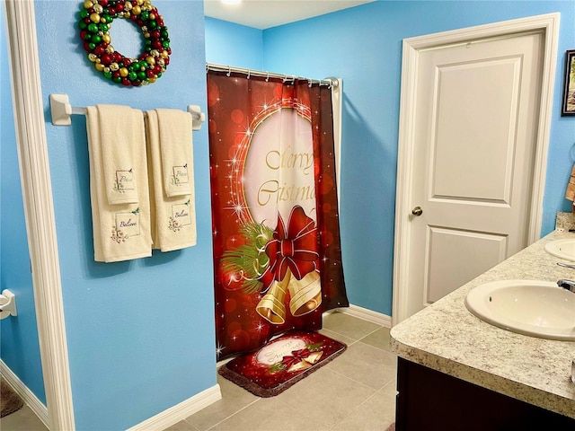 bathroom with tile patterned floors and vanity